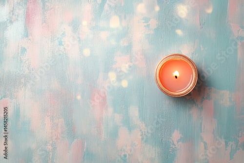 Beautiful glowing Diwal diya lamp with soft pink and blue background top view