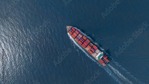 Obraz na płótnie Aerial view container cargo ship freight shipping international, Global business freight shipping import export logistic transportation container ship, Container cargo ship sea freight container ship. w salonie