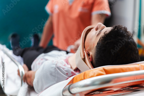 Nurses transporting a patient on a stretcher in a hospital setting for emergency medical care