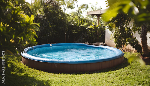 Above ground swimming pool on grass in backyard