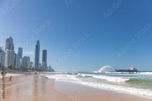 Gold Coast Skyline and Beach Near Sand Pumping Ship after cyclone
