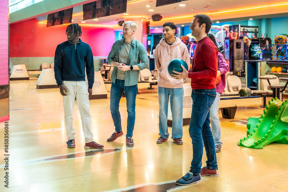 Diverse friends enjoying bowling together at the bowling alley