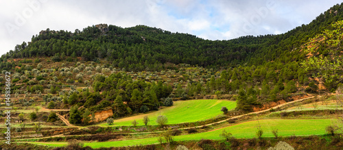 Obraz na płótnie Landscape between mountains around the medieval village of Rafales, Teruel, Spain. w salonie
