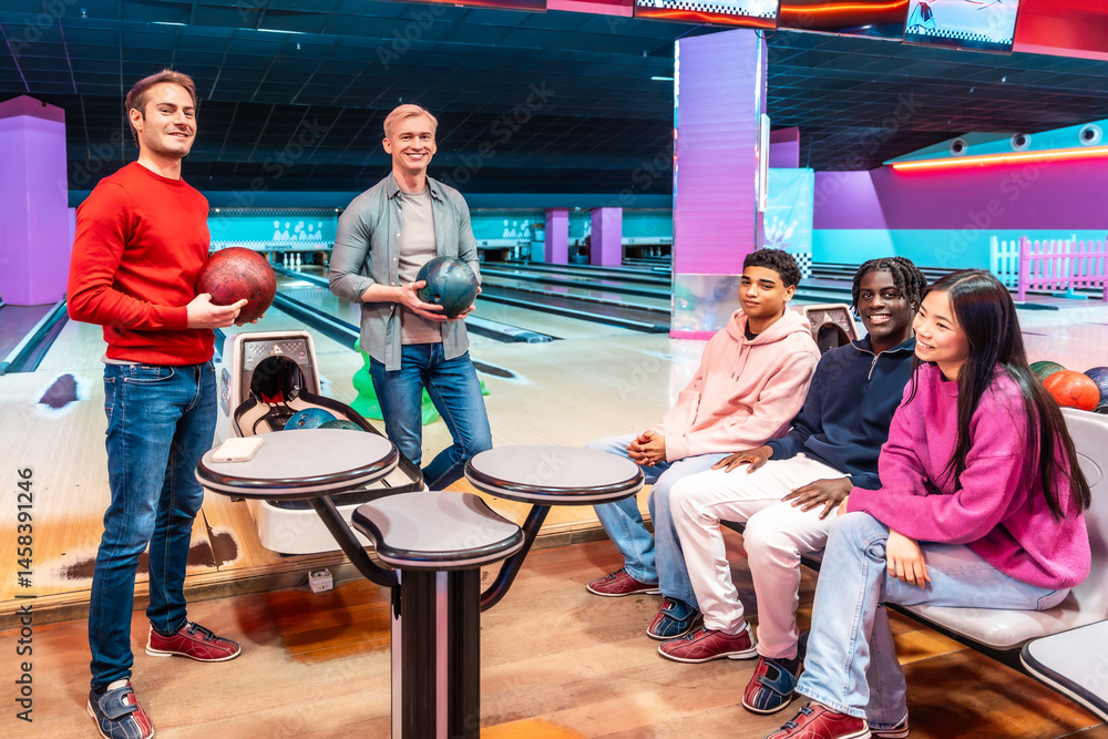 Friends playing bowling at the bowling alley