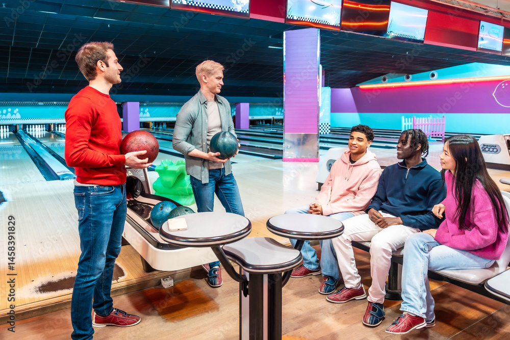 Friends enjoying bowling together at the bowling alley