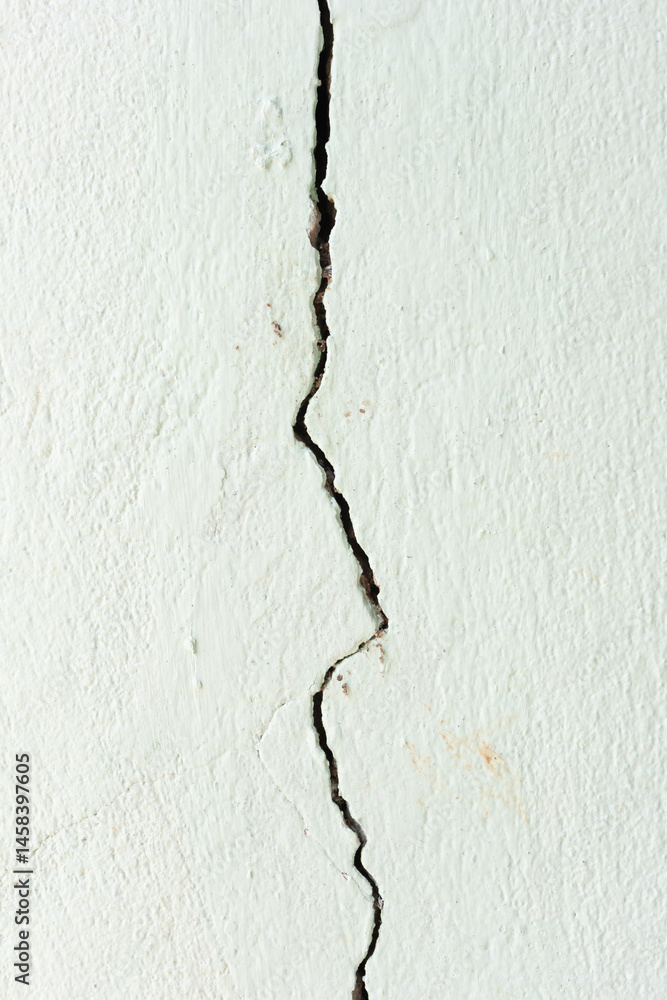 Obraz premium Large long crack or damage on concrete wall. Problem issue from low quality concrete, old, weathered or earthquake. Need repair by epoxy filler for flat smooth.