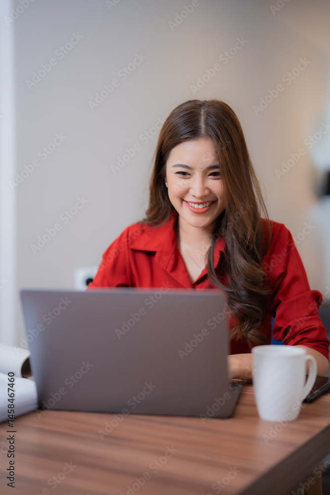 Happy businesswoman using laptop computer, working online and drinking coffee at workplace, cheerful female manager enjoying new project, successful business concept Happy businesswoman using laptop computer, working online and drinking coffee at workplace, cheerful female manager enjoying new project, successful business concept