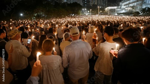 Illuminated Vigil: A sea of individuals gathers at dusk, holding lit candles in a display of unity, remembrance, and solidarity, with each flickering flame embodying hope and reflection.