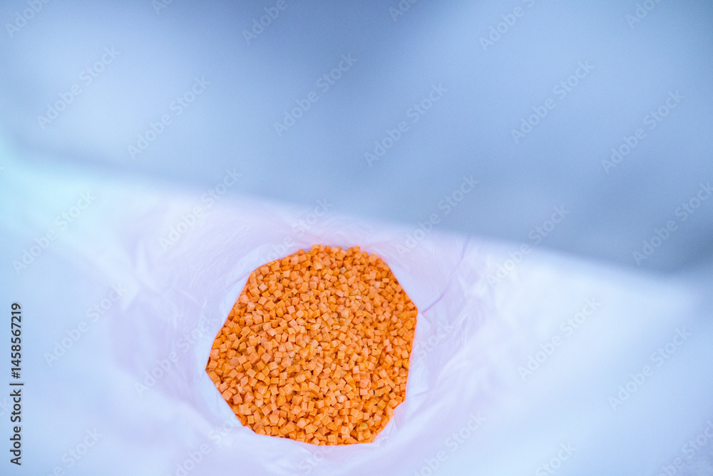 Bright diced carrot pieces, after passing through the shock-freezing chamber, are packaged in polyethylene bags by weight for shipment to customers. Рrepared for retail to ensure extended shelf life.