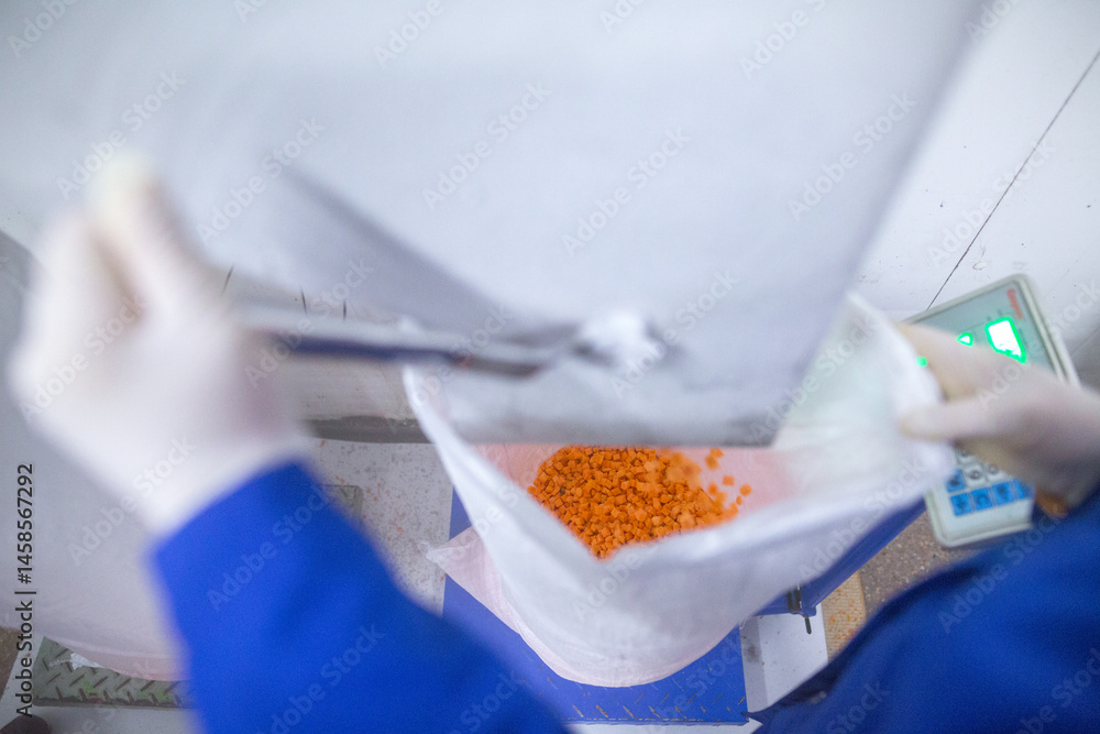 Bright diced carrot pieces, after passing through the shock-freezing chamber, are packaged in polyethylene bags by weight for shipment to customers. Рrepared for retail to ensure extended shelf life.