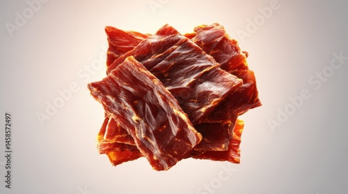 Obraz na płótnie Freshly Dried Beef Jerky Stack on Gradient Background for Snacks w salonie