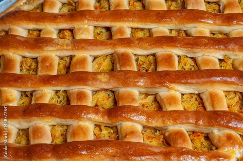 Obraz na płótnie Close-up of a homemade savory pie with a beautifully crafted lattice crust, freshly baked. w salonie