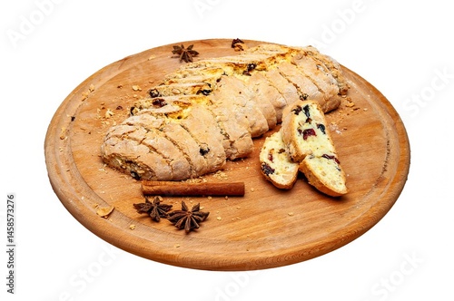 Obraz na płótnie Freshly baked biscotti, elegantly sliced and served with spices on a wooden plate. w salonie