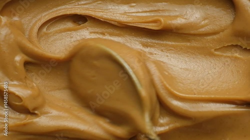 Detailed Peanut Butter Texture. Top View Slow Motion