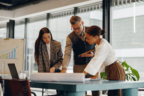 The team members engage in thorough discussions about strategies concerning project plans within a modern workspace