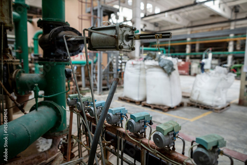 Obraz na płótnie Archaic outdated system of water treatment area for a heat exchanger circuit, including purification units and bags of filtration materials such as sulfocarbon, cationite, ionite, and anionite. w salonie