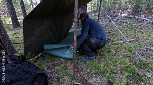 Lay out a sleeping mat in the forest