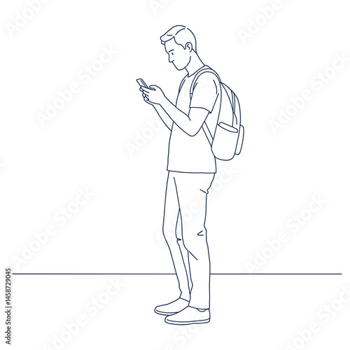 Focused Connection: A young man absorbed in his phone, standing still. Capture a moment of modern solitude and connectivity.