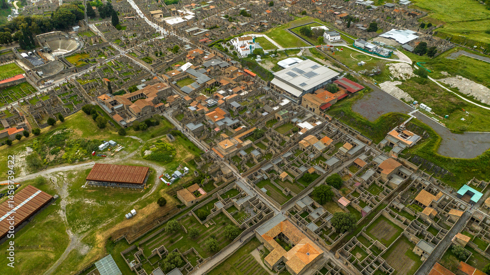 Aerial view of the archaeological park of Pompeii, located in the province of Naples, Campania, Italy. It is famous for the remains and ruins of the palaces and houses of an ancient Roman city.
