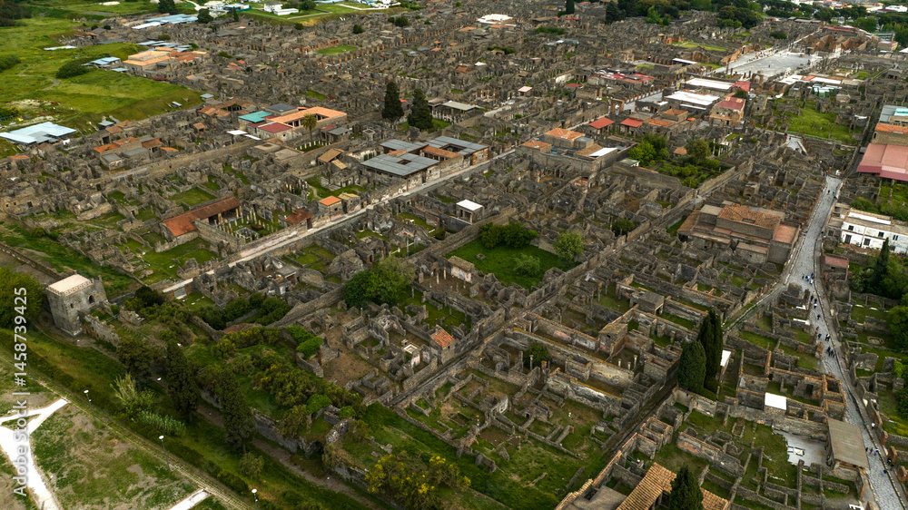 Aerial view of the archaeological park of Pompeii, located in the province of Naples, Campania, Italy. It is famous for the remains and ruins of the palaces and houses of an ancient Roman city.