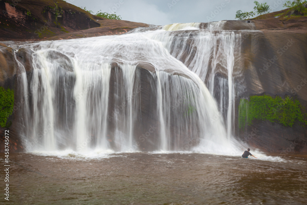 The grand beauty and fun water play and slides of Tham Phra Waterfall in the rainy season, Bueng Kan province Thailand
The grand beauty and fun water play and slides of Tham Phra Waterfall in the rainy season, Bueng Kan province Thailand