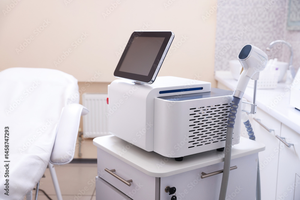 Laser hair removal machine and medical couch in beauty salon Laser hair removal machine and medical couch in beauty salon