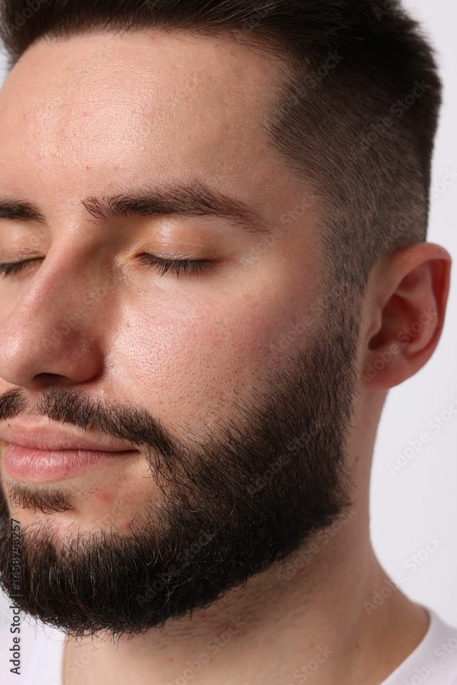 Obraz premium Man before eyebrows correction on light background, closeup