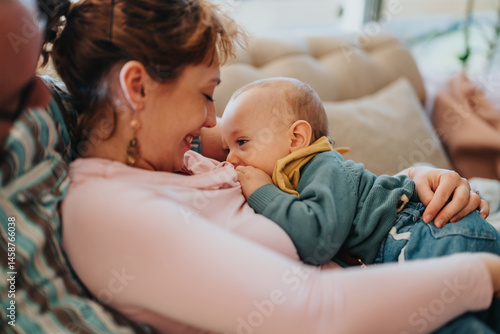 Canvastavla A tender moment of a mother bonding with her baby through breastfeeding, creating an intimate and loving environment