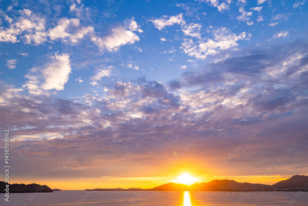 Fototapeta premium Nature beautiful light sunset or sunrise over sea surface,Colorful sunset sky with clouds and waves in the ocean,Wide angle sea background