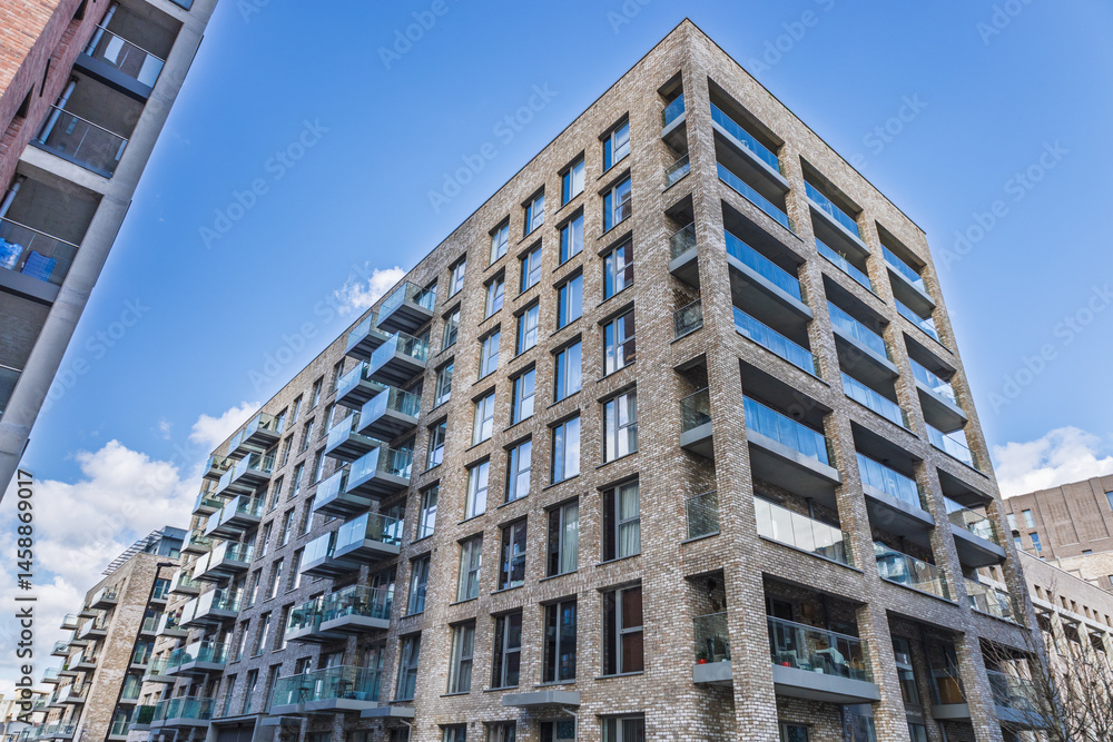 Fototapeta premium Modern urban apartment building with balconies