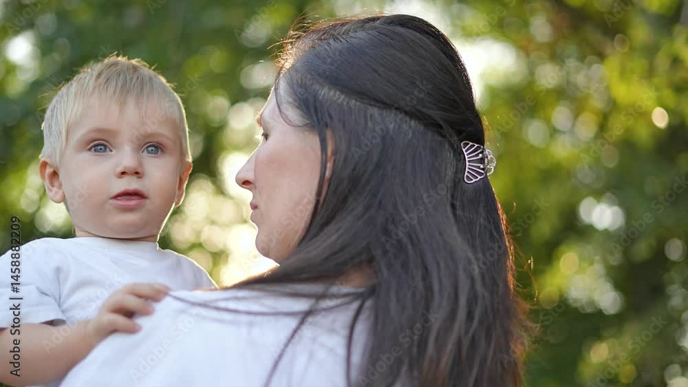 Mother play with child outdoors. Close up mother bonding with child in nature. Happy family moment during play. Emotional connection between mother and child. Playful interaction loving family setting Mother play with child outdoors. Close up mother bonding with child in nature. Happy family moment during play. Emotional connection between mother and child. Playful interaction loving family setting