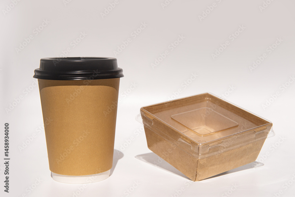 Eco-friendly coffee cup and takeout container on white background