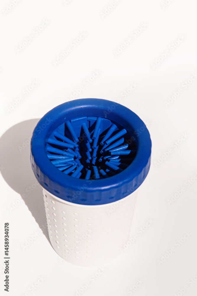Blue bristle cleaning tool for bottles and containers on white background