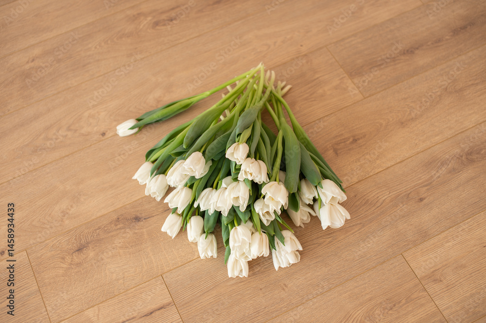 White Tulips on Wooden Floor - Fresh Spring Flowers Indoors