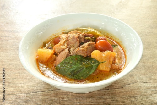 Obraz na płótnie spicy boiled roasted duck meat with pineapple and tomato in coconut milk curry soup on bowl w salonie