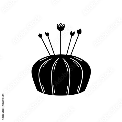 Crafting tools represented by a flat black icon of a pincushion with pins and flowers