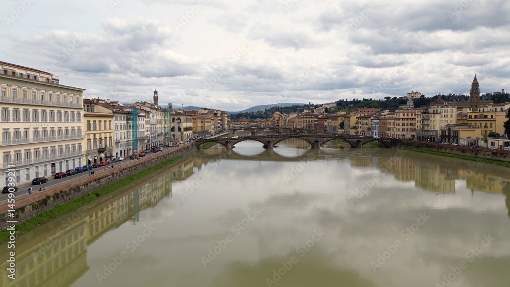 Obraz premium Europe, Italy, Florence , drone aerial view of Florence and Arno river - the Old Bridge , Ponte Vecchio , in city downtown of the Middle Ages and Renaissance art - Tourist attraction destination
