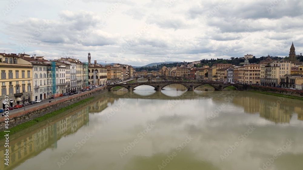 Obraz premium Europe, Italy, Florence , drone aerial view of Florence and Arno river - the Old Bridge , Ponte Vecchio , in city downtown of the Middle Ages and Renaissance art - Tourist attraction destination 