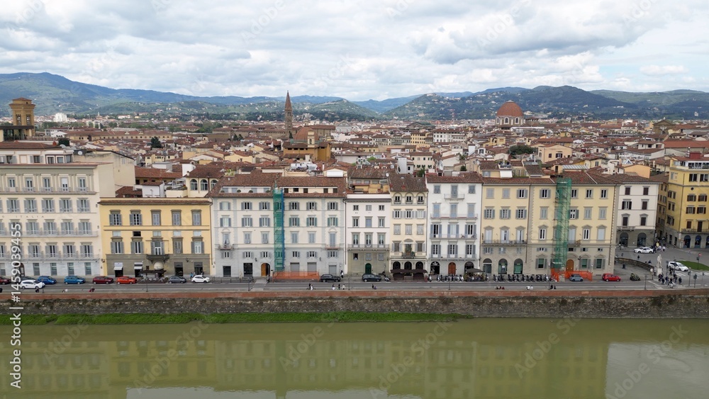 Obraz premium Europe, Italy, Florence , drone aerial view of Florence and Arno river - the Old Bridge , Ponte Vecchio , in city downtown of the Middle Ages and Renaissance art - Tourist attraction destination 