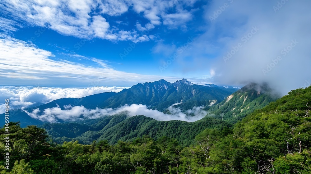 Obraz premium Majestic mountain range viewed from above, showcasing lush green forests, dramatic peaks, and a sea of clouds under a vibrant blue sky. The scene evokes a sense of serenity and natura : Generative AI