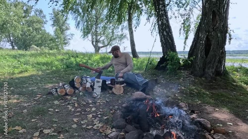 A tourist sleeps outdoors in the forest