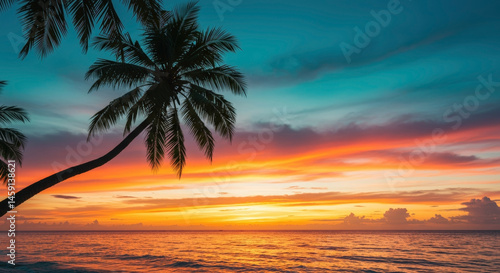 Palm trees silhouettes against vibrant sunset sky over ocean. Tropical paradise scene. Exotic beach vacation. Romantic evening atmosphere. Summer holiday destination. Travel