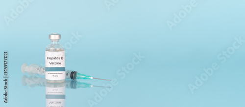 Hepatitis B vaccine vial bottle with syringe on blue background. Hepatitis B vaccine used to prevent hepatitis B virus infection, which can lead to cirrhosis and liver cancer.
