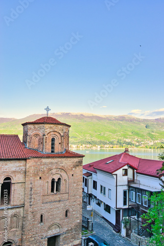 Wallpaper Mural Lake Ohrid, North Macedonia, April 13 2024. Mountain range and peninsula in distance. Ohrid Lake, Macedonia, Europe. The clear mesmerizing waters of lake Ohrid with a beautiful view.  Torontodigital.ca