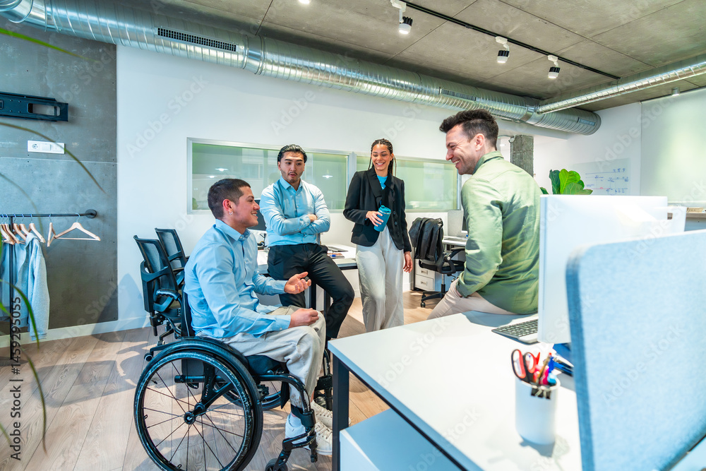 Diverse business team collaborating in modern office, wheelchair user leading discussion