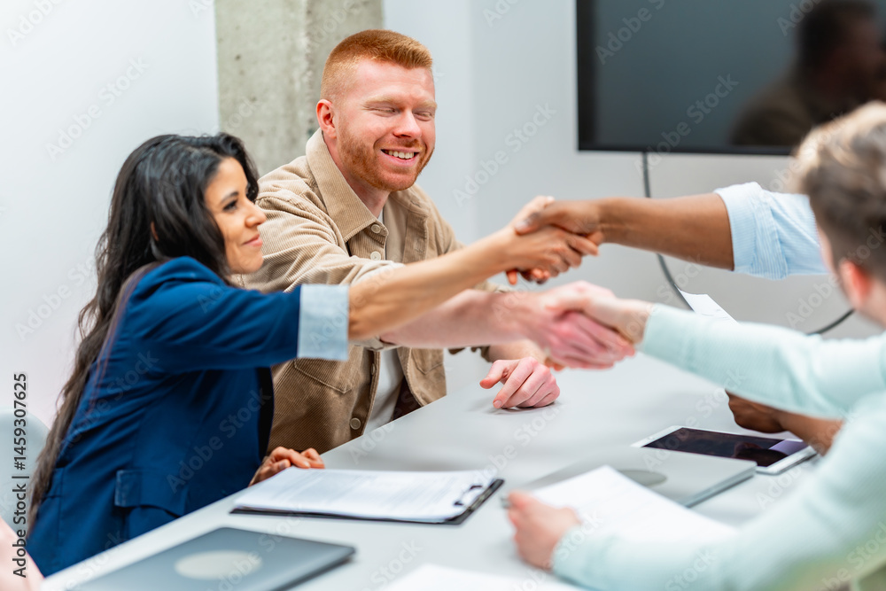 Business people shaking hands during meeting in the office