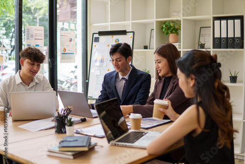 Group of coworkers brainstorming during a collaborative meeting.