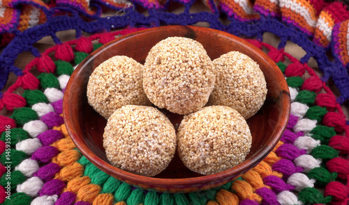 Amarnath seed, Cholai or Rajgira laddo, Also in cube shape called chikki or cake form, Indian sweet and healthy food served in a plate and bowl. Selective focus.