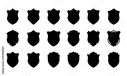 A collection of black shield icons in various shapes and designs against a white background.