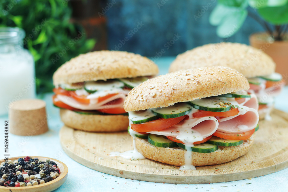 Bun sandwiches with salami and vegetables